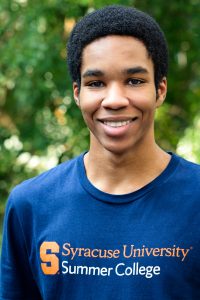 Syracuse University pre-college student wearing a Summer College student shirt