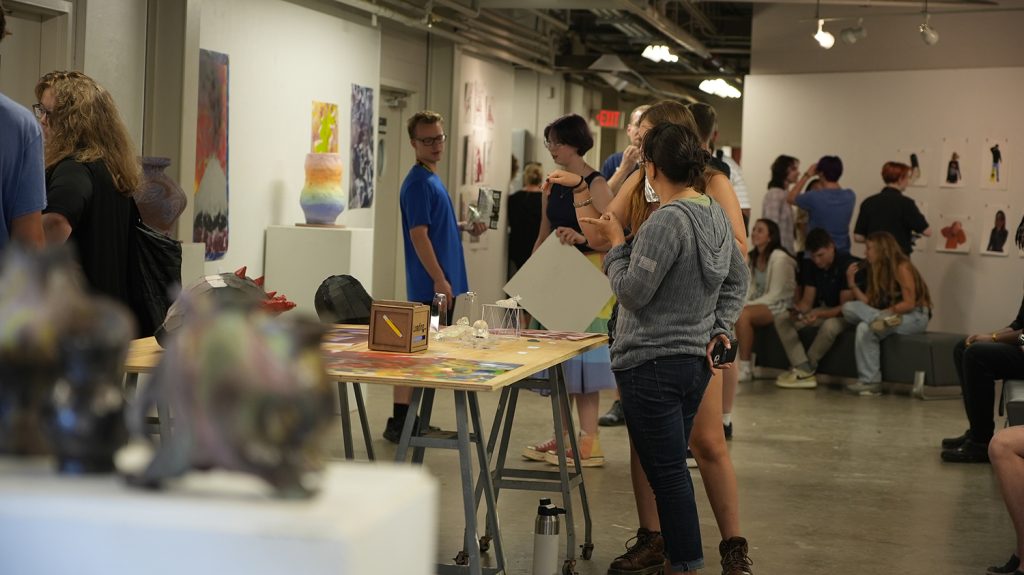 Summer College students participate in the art academy final exhibition.