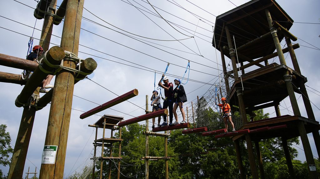 Summer College students participate in an obstacle course during the team and leadership academy. 
